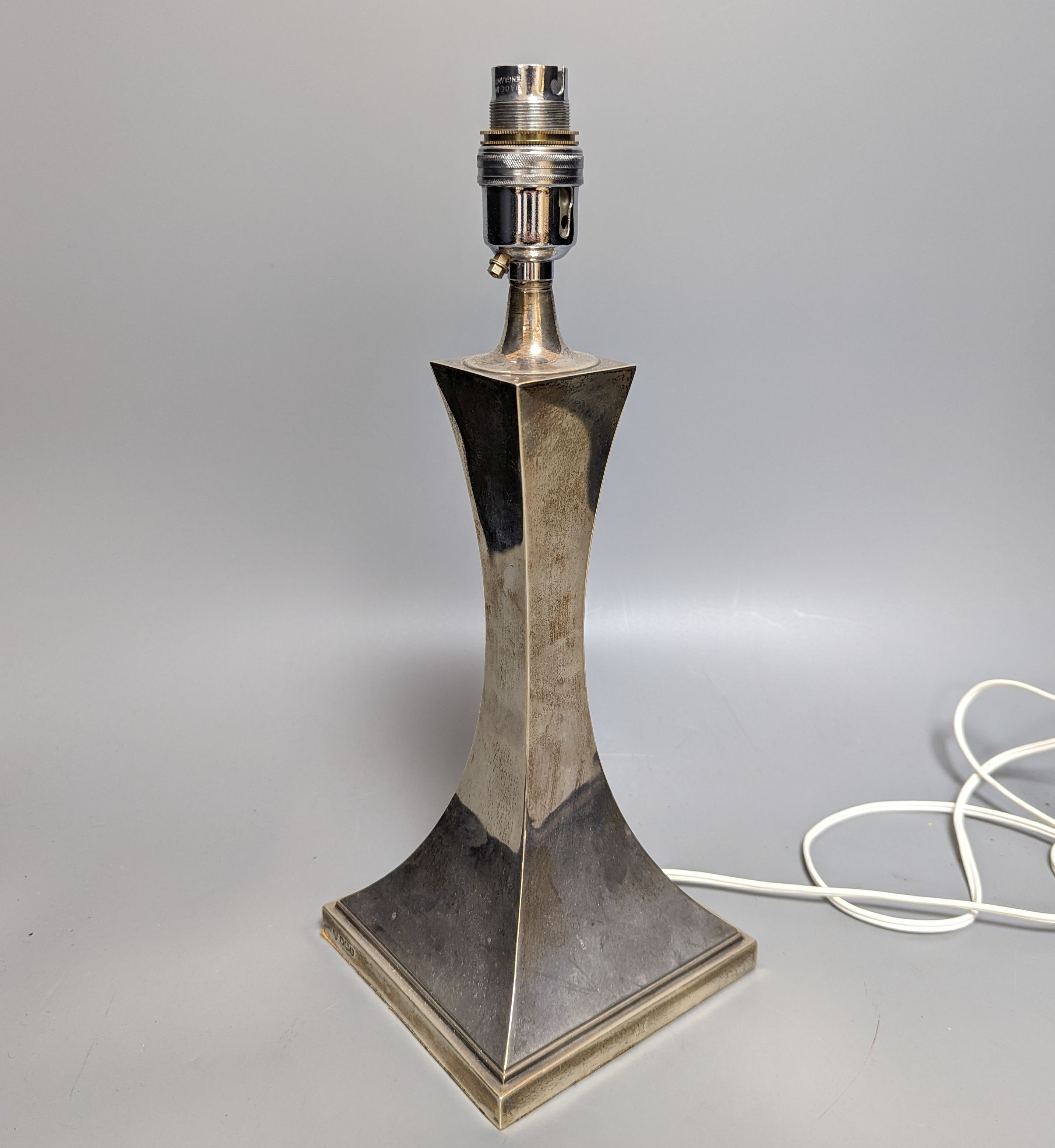 A George V silver lamp base, Hawksworth, Eyre Ltd, Sheffield, 1925, overall height 35cm.